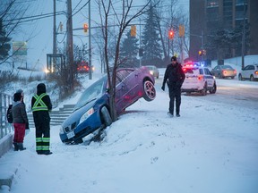 Cars like this one on Meadowlands near Chesterton Drive were slip-sliding in the early going, but there were few serious crashes, police said.