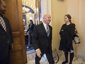 House Ways and Means Committee Chairman Kevin Brady, R-Texas, leaves his office in the Capitol as House Republicans prepare to advance the GOP tax bill, in Washington, Friday, Dec. 15, 2017.