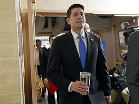 House Speaker Paul Ryan of Wis., center, arrives for a meeting of House Republicans on Capitol Hill in Washington, Tuesday, Dec. 19, 2017. Republicans are ready to ram a $1.5 trillion tax package through Congress, giving President Donald Trump the legislative win he desperately wants.