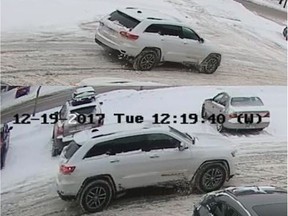 Photo of a white Jeep Cherokee that may be connected with the drugging and robbing of an elderly woman in her home Dec. 7.