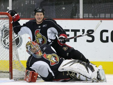 L2R Ottawa Senators' Chris Neil runs into Martin Gerber, during practice, at Scotiabank Place, on Oct. 17, 2007, in Ottawa.