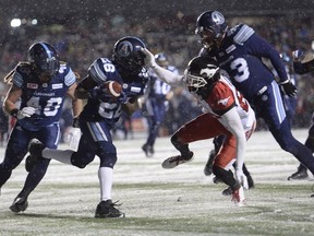 Toronto Argonauts defensive back Cassius Vaughn (26) recovers the football on a fumble by Calgary Stampeders slotback Kamar Jorden (88) and returns the ball 109 yards for a touchdown late in the fourth quarter of the Grey Cup game in Ottawa on Nov. 26.