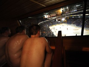 Spectators watch a professional hockey match from a sauna at the Hartwall Arena in Helsinki. Oh yes, Finland has Canada beat when it comes to doing winter properly.