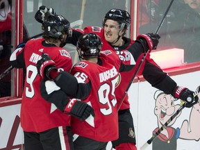 Ottawa Senators right-winger Mark Stone (61) and centre Matt Duchene (95) congratulate teammate Bobby Ryan on his goal in the first period against the New York Rangers at the CTC on Wednesday, Dec. 13, 2017.
