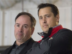 Senators general manager Pierre Dorion, left, with head coach Guy Boucher.