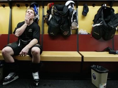 Ottawa Senators Chris Neil pauses for a moment in the team's dressing room following a practice session at the Corel Centre in Ottawa, Tuesday April 22, 2003.