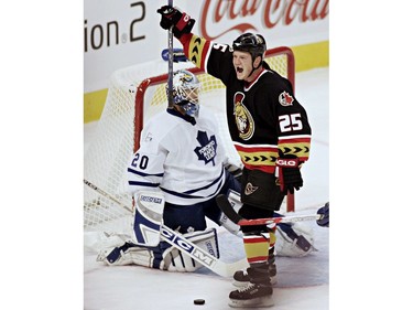 Ottawa Senators' Chris Neil celebrates his goal against Toronto Maple Leafs' Ed Belfour during first period NHL action in Ottawa Monday, Oct. 10, 2005.