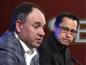 Ottawa Senators coach Guy Boucher looks on as general manager Pierre Dorion answers questions from media at a wrap up press conference in Ottawa on Monday, May 29, 2017.