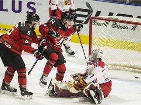 Canada's Maxime Comtois (14) celebrates after teammate Cal Foote scored past Czech Republic goalie Jakub Skarek during the third period in their World Junior Championships pre-tournament game in London Ont. on Wednesday, December 20, 2017.