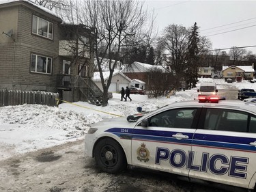 Police investigate the scene of a homicide in Vanier. Ashley Fraser/Postmedia