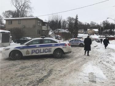 Police can be seen on Freshette Street in Vanier. A man was shot on early Saturday morning. He later died in hospital. Ashley Fraser/Postmedia