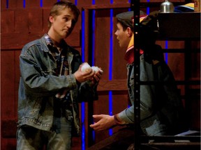 Stewart Penny performs as George Milton (L) and Tim Koniaev performs as Lennie Small (R) during Holy Trinity Catholic High School's Cappies production of Of Mice and Men, on December 14, 2017, in Ottawa, On.