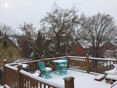 A summer patio set is buried under the first big snow in Ottawa.