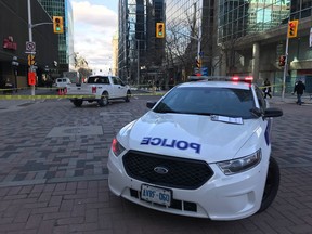 Police on the scene of collision at Kent and Albert in which a pedestrian was struck by a white pickup truck.