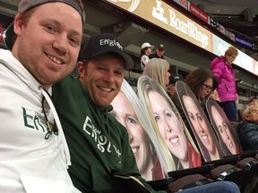 Jordan Hogan, left, and Brandy Westcott with their oversized cutouts of members of Michelle Englot's curling team at the Canadian Tire Centre in Ottawa during the Canadian Olympic curling team trials on Wednesday, Dec. 6, 2017. Photo by Ken Warren/Postmedia