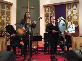 Leela Gilday, left, and Sylvia Cloutier, perform with NACO members in Iqaluit.