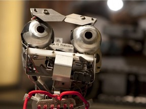 An IT model robot is displayed at iRobot Corp. headquarters in Bedford, Massachusetts back in 2011. IRobot Corp. makes the Roomba and Scooba floor-cleaning machines and the PackBot, a robot that can search caves and help with bomb-disposal missions. (Photographer: Scott Eells/Bloomberg)