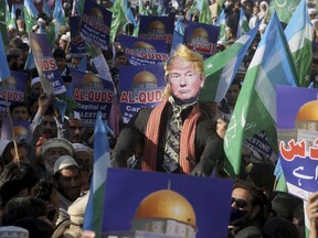 Supporters of Jamaat-e-Islami take part in an anti-American rally to condemn U.S. President Donald Trump for declaring Jerusalem as Israel's capital, in Peshawar, Pakistan, Friday, Dec. 22, 2017.