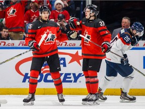 Canada's Jordan Kyrou, left, celebrates his goal with Sam Steel during a world junior game against Slovakia on Dec. 27, 2017