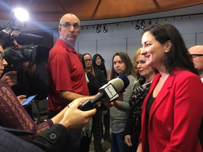 Marie Montpetit, Quebec's minister of culture and communications, scrums with reporters in Trois-Rivieres, Que., Monday, Dec.4, 2017 after detailing how the provincial government will be spending $36.4 million to help the written press. The funds were already allocated in the last budget announcement and should be invested over the next five years.