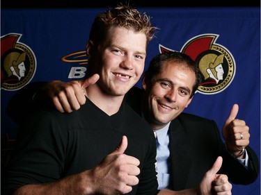 Ottawa-07/24/05-L2R Ottawa Senators' Chris Neil and Chris Phillips ham it up at as they pose for a photo at the Ottawa Senators press conference to announce the start of the 2005-2006 NHL season.