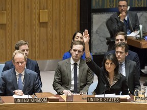 U.S. Ambassador to the United Nations Nikki Haley, right, votes against a resolution on Monday, Dec. 18, 2017, that would have required President Donald Trump to rescind his declaration of Jerusalem as the capital of Israel.