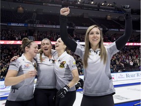 Skip Rachel Homan of Ottawa, Ont. pumps her fists as second Joanne Courtney, third Emma Miskew and lead Lisa Weagle celebrate defeating Team Carey in the women's final at the 2017 Roar of the Rings Canadian Olympic Trials in Ottawa on Sunday, Dec. 10, 2017.