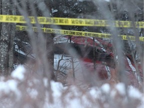 The crash Hydro One helicopter can be seen at the crash site near Tweed, Ont., on Dec. 14, 2017. Four Hydro One employees were killed Thursday in a helicopter crash in eastern Ontario, police and the utility reported.The crash occurred about noon in Tweed, north of Kingston, provincial police said.