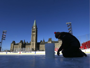 The 19th annual Bell Capital Cup officially got underway at the Canada 150 hockey rink on Parliament Hill in Ottawa Wednesday Dec 27, 2017. The Brampton Canadettes (white and blue) and the Kanata Rangers made it through the first period of the 10:10 a.m. game Wednesday before it was called off due to poor ice conditions as a result from the weather being too cold. Ryan Caron from Capital Sports Management fixes some ruts in the damaged ice Wednesday.    Tony Caldwell