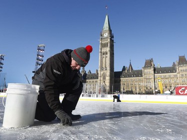 The 19th annual Bell Capital Cup officially got underway at the Canada 150 hockey rink on Parliament Hill in Ottawa Wednesday Dec 27, 2017. The Brampton Canadettes (white and blue) and the Kanata Rangers made it through the first period of the 10:10 a.m. game Wednesday before it was called off due to poor ice conditions as a result from the weather being too cold. Ryan Caron from Capital Sports Management fixes some ruts in the damaged ice Wednesday.    Tony Caldwell