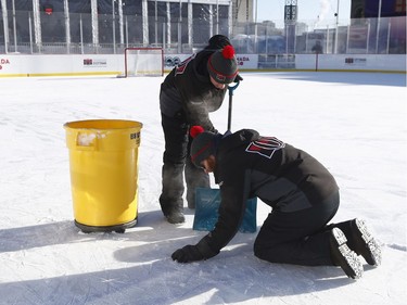 The 19th annual Bell Capital Cup officially got underway at the Canada 150 hockey rink on Parliament Hill in Ottawa Wednesday Dec 27, 2017. The Brampton Canadettes (white and blue) and the Kanata Rangers made it through the first period of the 10:10 a.m. game Wednesday before it was called off due to poor ice conditions as a result from the weather being too cold. Ice crews from Capital Sports Management fix some ruts in the damaged ice Wednesday.    Tony Caldwell