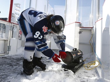 The 19th annual Bell Capital Cup officially got underway at the Canada 150 hockey rink on Parliament Hill in Ottawa Wednesday Dec 27, 2017. The Brampton Canadettes (white and blue) and the Kanata Rangers girls Pee-Wee AA made it through the first period of the 10:10 a.m. game Wednesday before it was called off due to poor ice conditions as a result from the weather being too cold. A Brampton player warms her hands up Wednesday.    Tony Caldwell