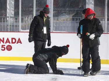 The 19th annual Bell Capital Cup officially got underway at the Canada 150 hockey rink on Parliament Hill in Ottawa Wednesday Dec 27, 2017. The Brampton Canadettes (white and blue) and the Kanata Rangers made it through the first period of the 10:10 a.m. game Wednesday before it was called off due to poor ice conditions as a result from the weather being too cold. Ice crews from Capital Sports Management fix some ruts in the damaged ice Wednesday.    Tony Caldwell