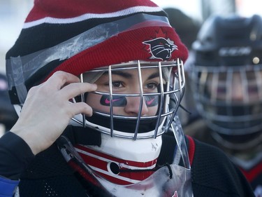 The 19th annual Bell Capital Cup officially got underway at the Canada 150 hockey rink on Parliament Hill in Ottawa Wednesday Dec 27, 2017. Nepean Wiildcats goalie Alexis Jandciu adjusts her hat before going out on the Canada 150 ice on Parliament Hill Wednesday.     Tony Caldwell