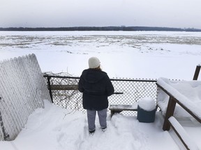 Sylvie Goneau looks out to the Ottawa river in the backyard of her rebuilt home in Gatineau Tuesday Dec 19, 2017. Goneau and her family decided to rebuild on Blvd Hurtubise in Gatineau after the major flood.   Tony Caldwell