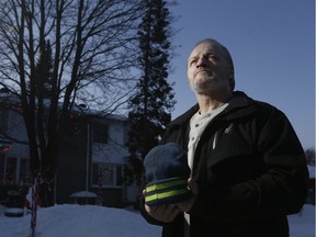 Dave Gignac watched helplessly on Christmas Eve as a man was hit by at least two vehicles and dragged about a kilometre along Baseline and Merivale roads. Gignac is holding the victim's hat.