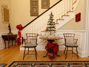 Joan Burney takes a minimalist approach to decorating her home at Christmastime so as not to interfere with her collection of antique furniture.