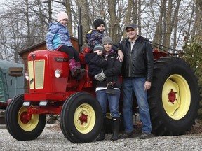 Mike Thompson stands with Jillian O'Connor and her kids Mya, Landon and Declan near Mississippi Mills last month. Thieves recently broke Thompson's property and stole thousands of dollars worth of tools.