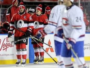 Sens captain Erik Karlsson (L) looks a little cold as he takes the warm up as the Ottawa Senators take on the Montreal Canadiens in the 2017 Scotiabank NHL 100 Classic outdoor hockey game at TD Place in Ottawa.