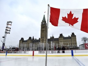 The front lawn of Canada's Parliament in Ottawa. In 2018, the authors write, we must work to better protect and strengthen our democracy.