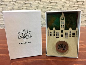 A Canada 150 Sesquicentennial pin, made from a bit of reclaimed metal from Parliament's roof.