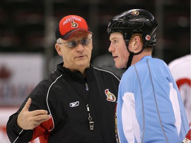 L2R Ottawa Senators' General Manager and head coach Bryan Murray chats with Chris Neil, during their practice at Scotiabank Place, on Mar 28, 2008, in Ottawa.