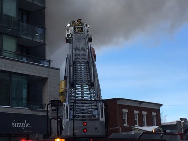 Firefighters on the scene of a two-alarm fire on Richmond Road Friday.