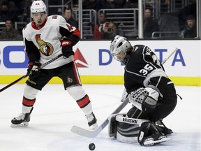 Senators forward Jean-Gabriel Pageau watches as Kings goalie Darcy Kuemper makes a save during Thursday's game at L.A.