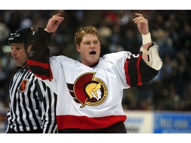 Ottawa, Ontario- 03/03/03- Ottawa Senators Chris Neil waves to crowd after getting into a fight with Tie Domi.