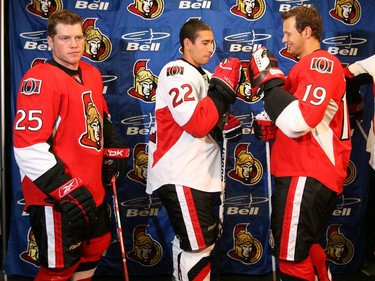 (L2R) #25 RW Chris Neil, #22 C Chris Kelly and #19 C Jason Spezza model the new Sens logo. The Ottawa Senators invited fans to Scotiabank Place this evening as the team introduced a "new look" (fitted) Reebok jersey and complete uniform. Aug. 22, 2007.