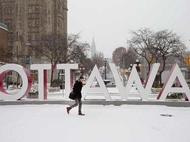 The Ottawa sign in the Byward Market as the region begins to deal with the first major snowfall of the winter.