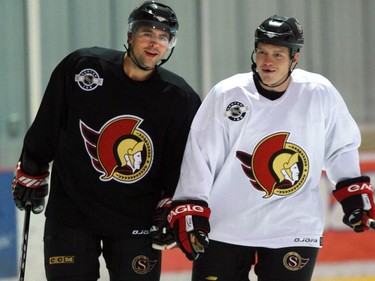 The Ottawa Senators begin the first day on the ice during training camp at the Bell Sensplex.   Chris Phillips and Chris Neil at the start of practice.