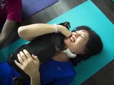 Cindy Wynter was all smiles as she got a puppy hug during class.