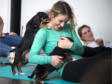 Erika Polidori gets a hug during class.